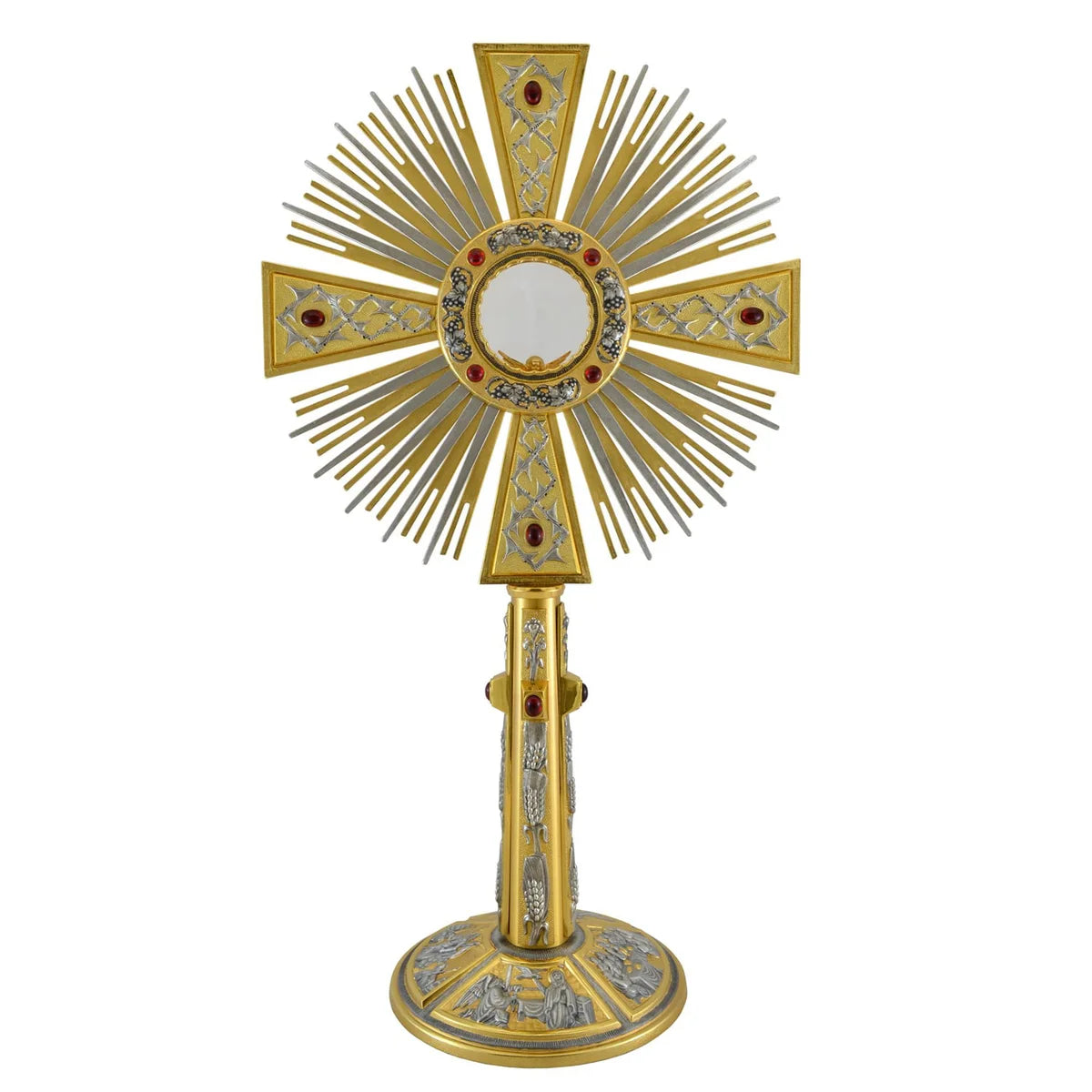 Monstrance in brass with red stones