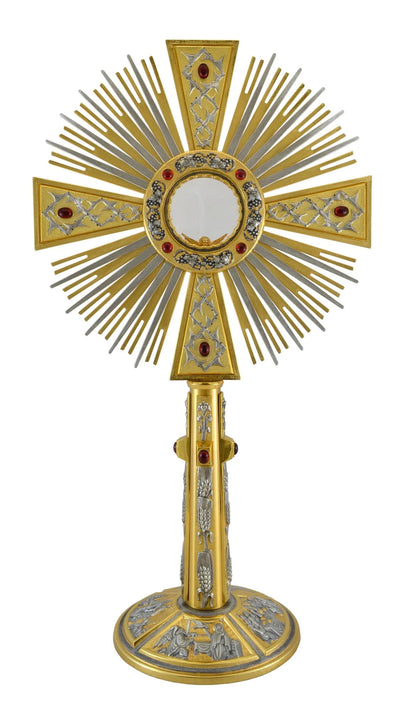 Monstrance in brass with red stones