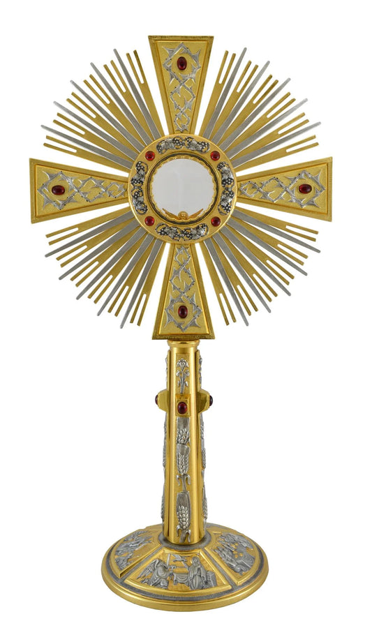 Monstrance in brass with red stones