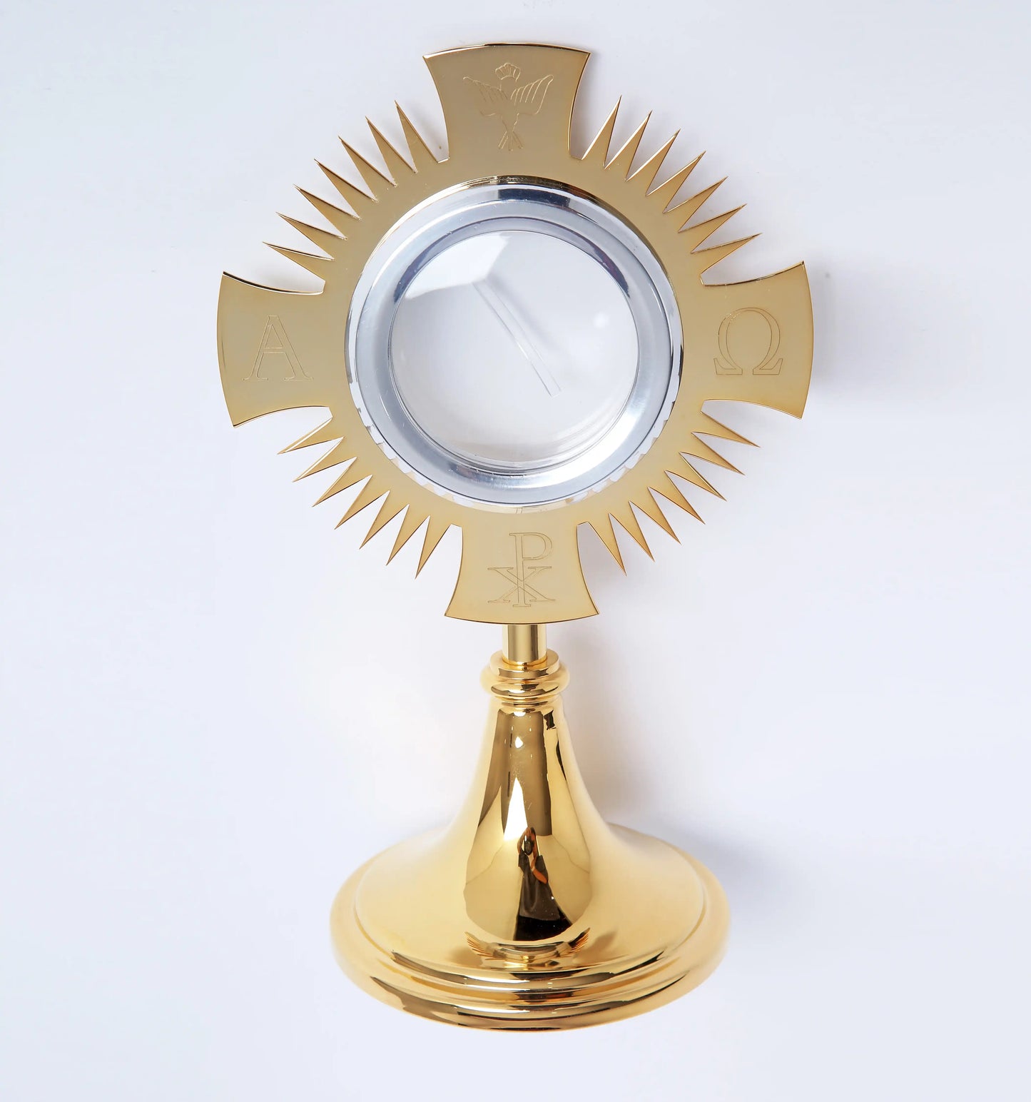 Monstrance in golden brass with Alpha Omega